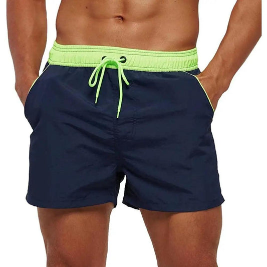 Men's navy swim shorts by Stevvex with neon lime waistband and drawstring, pockets beach trunks on Tampa Home & Garden Store