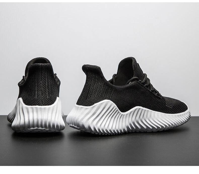 Stevvex black mesh running sneakers pair with white ribbed outsole on Tampa Home & Garden Store