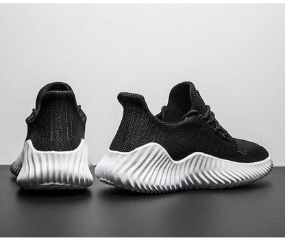 Stevvex black mesh running sneakers pair with white ribbed outsole on Tampa Home & Garden Store