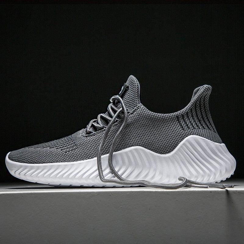 Stevvex men's breathable mesh sneakers with grey knit upper and white wavy sole on Tampa Home & Garden Store