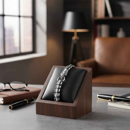 Mens dragon scale bracelet in silver alloy metal, symmetrical chunky wrist bangle on black cushion in wooden display on Tampa Home & Garden Store