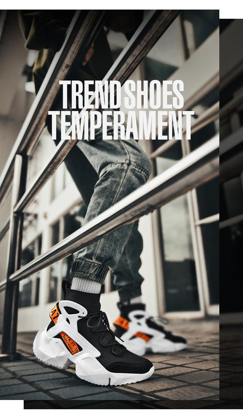 Pair of men's high-top sneakers with black mesh upper and white chunky sole with orange accents on Tampa Home & Garden Store