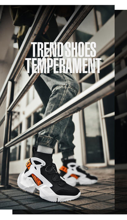 Pair of men's high-top sneakers with black mesh upper and white chunky sole with orange accents on Tampa Home & Garden Store