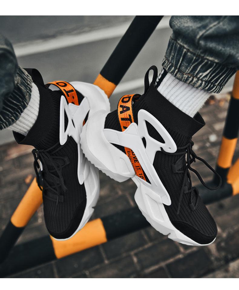 Stevvex men's top sneakers with black knit sock upper, white chunky sole and orange pull strap on Tampa Home & Garden Store