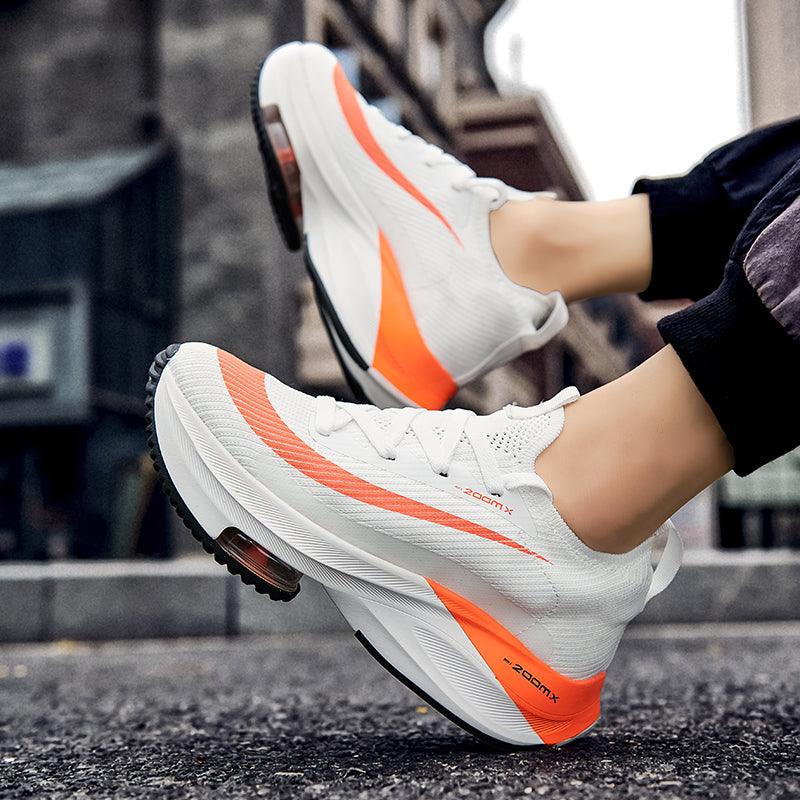 Men's Stevvex running sneakers white with orange accents, breathable upper and air cushion sole on Tampa Home & Garden Store