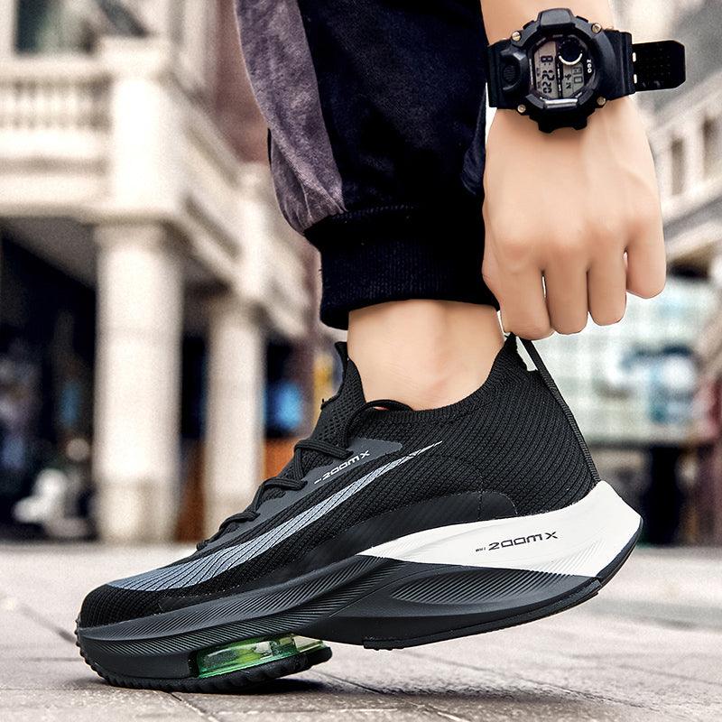 Stevvex men's running shoes black knit upper breathable with white midsole and green air cushion on Tampa Home & Garden Store