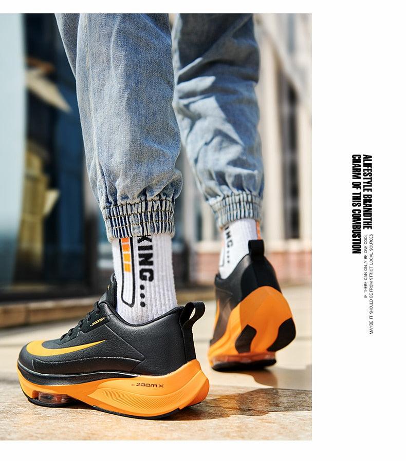 Stevvex men's running sneakers black upper with orange sole, breathable lace-up trainer on Tampa Home & Garden Store