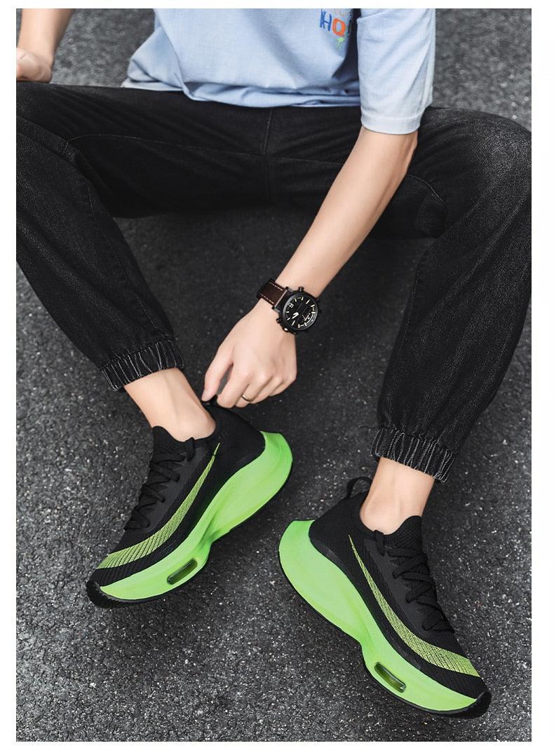 Pair of black knit running sneakers with neon green air-cushioned sole breathable lightweight on Tampa Home & Garden Store