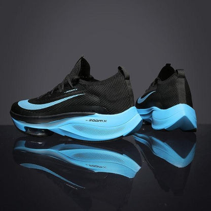 Stevvex Mens Running Sneakers pair with black knit upper and blue cushioned sole on Tampa Home & Garden Store