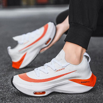 Mens running sneakers Stevvex white lace-up with orange accents and air-cushioned sole pair on Tampa Home & Garden Store