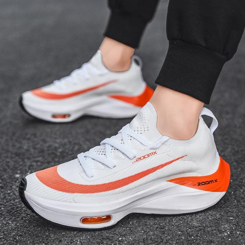 Mens running sneakers Stevvex white with orange stripe, breathable upper, air cushion sole on Tampa Home & Garden Store