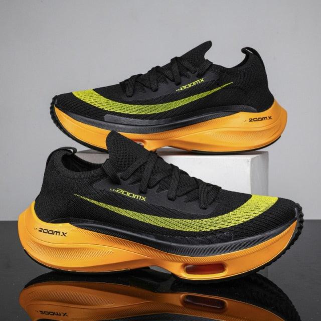 Stevvex mens running sneakers pair black knit upper with neon lime stripe and orange sole on Tampa Home & Garden Store
