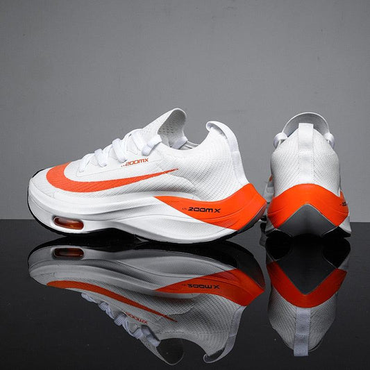 Stevvex men's running sneakers white with orange accents, breathable mesh, air cushion sole on Tampa Home & Garden Store