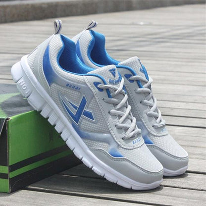 Men's sport running sneakers Stevvex pair, white mesh with blue accents, lightweight shoes on Tampa Home & Garden Store