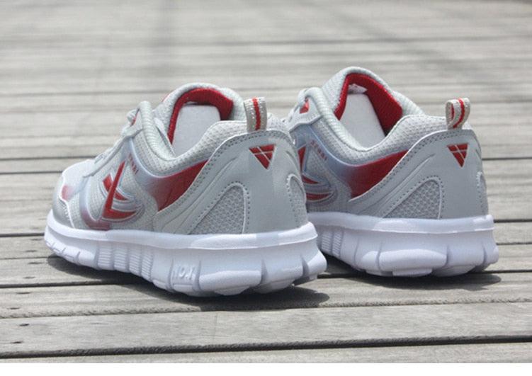 Stevvex men's sport running sneakers, breathable white/gray mesh with red accents, pair on Tampa Home & Garden Store