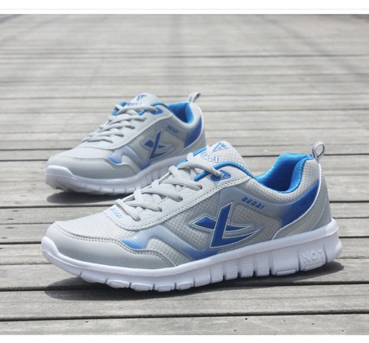 Stevvex men's running sneakers breathable mesh, light gray with blue accents, pair on Tampa Home & Garden Store