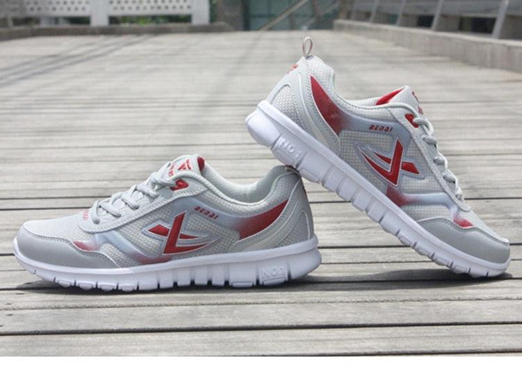 Stevvex men's running sneakers breathable mesh white with red accents on Tampa Home & Garden Store