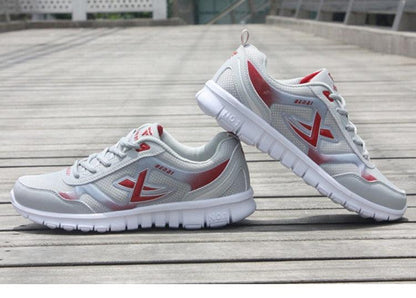 Stevvex men's running sneakers breathable mesh white with red accents on Tampa Home & Garden Store