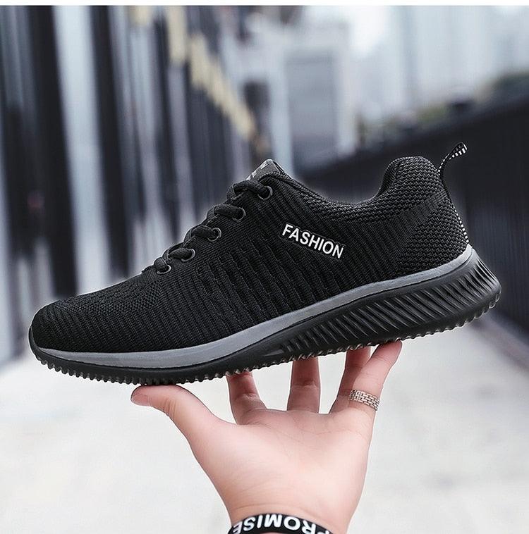 Men's black mesh running sneakers with lace-up, cushioned sole and FASHION label on side on Tampa Home & Garden Store