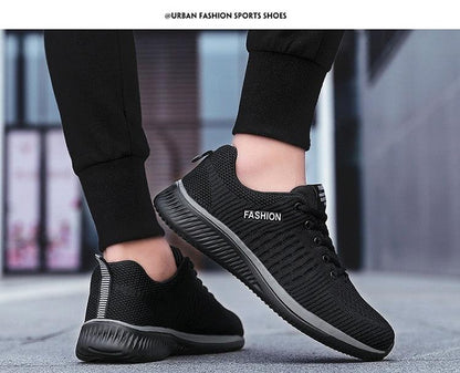 Mens black mesh running sneakers with breathable mesh, gray sole, lace-up on Tampa Home & Garden Store