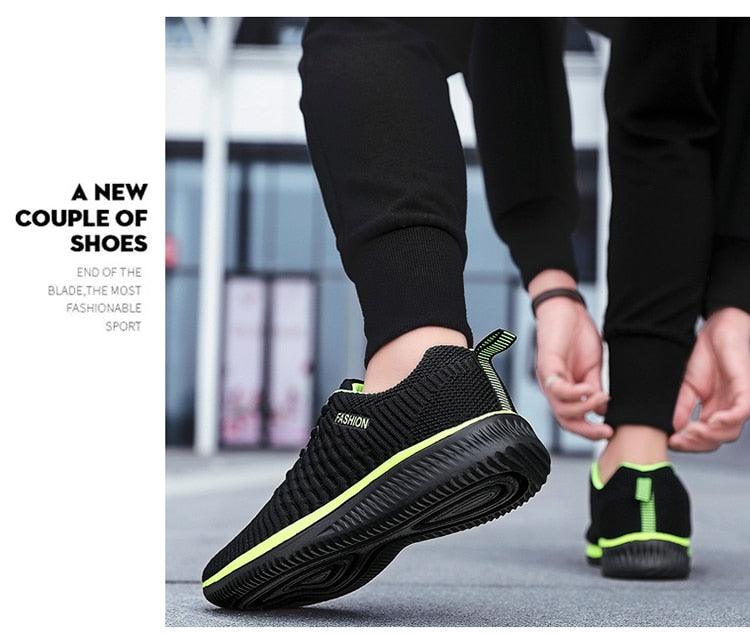 Stevvex mens sport running sneakers pair black mesh with neon green sole trim on Tampa Home & Garden Store