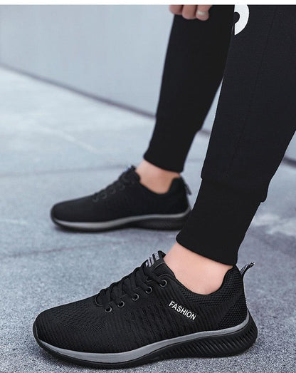 Stevvex men's running sneakers black breathable mesh upper with FASHION text gray sole on Tampa Home & Garden Store