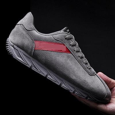 Men's Stevvex sneakers, grey textured upper with red side stripe, lightweight non-slip sole on Tampa Home & Garden Store