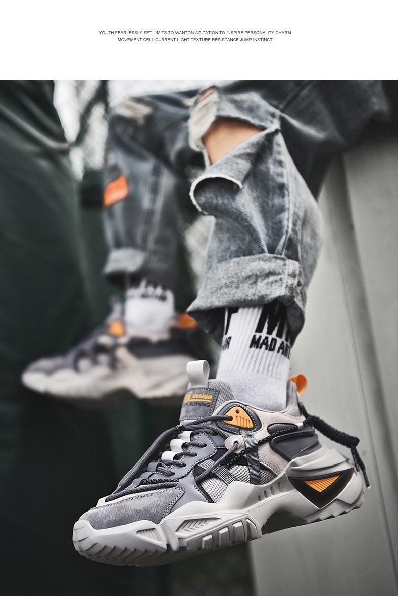 Stevvex men's chunky sneakers with grey upper, orange accents and thick sole on Tampa Home & Garden Store