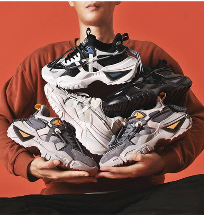 Stevvex men's chunky sneakers with thick soles in white, gray and black (5p) held by a person on Tampa Home & Garden Store