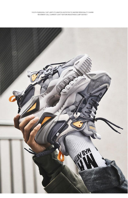 Stevvex Mens chunky sneakers with thick spring sole, gray/white upper and orange accents on Tampa Home & Garden Store