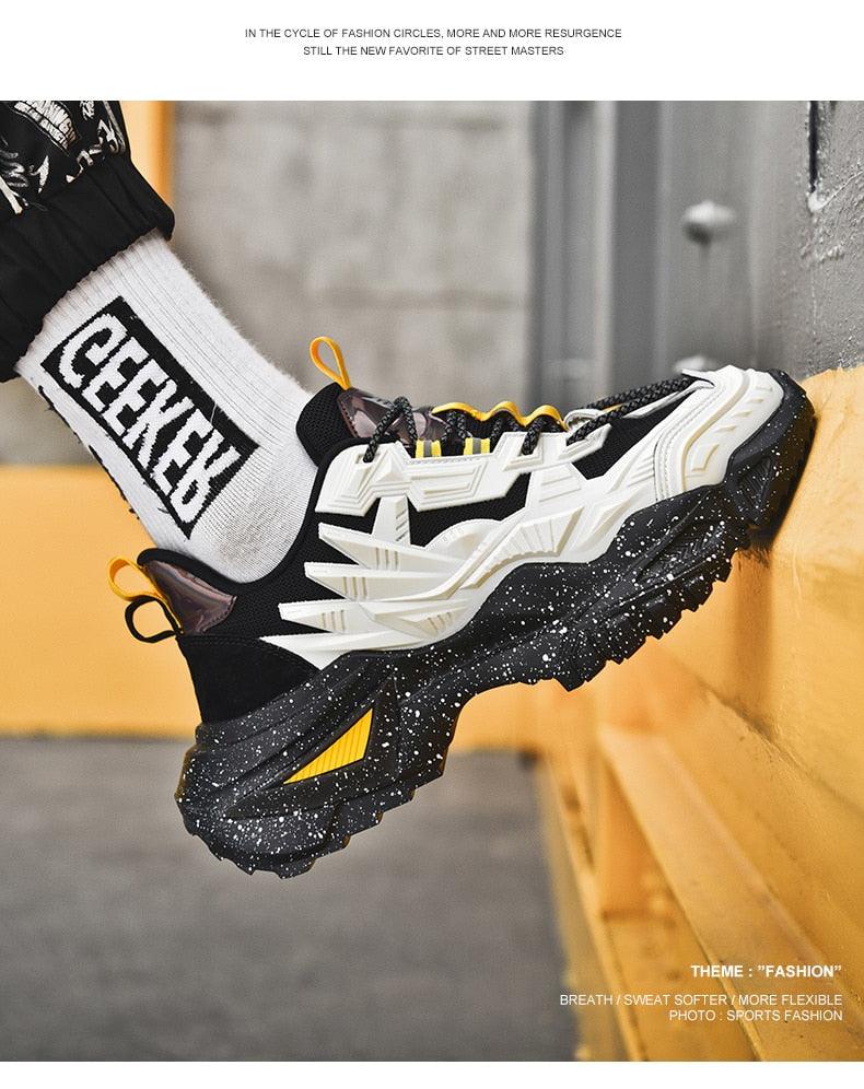 Stevvex men's chunky sneakers with thick speckled black sole, white panels and yellow accents on Tampa Home & Garden Store