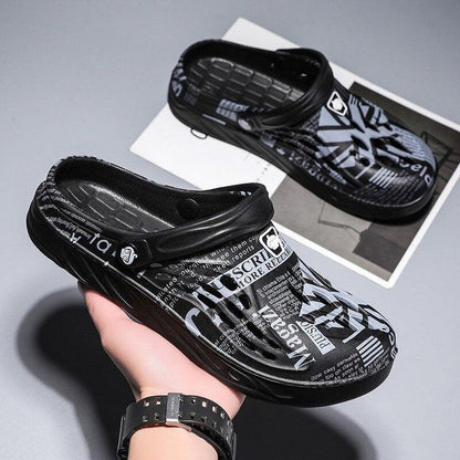 Stevvex black slip-on clogs with white printed text design, 2 shoes shown on Tampa Home & Garden Store