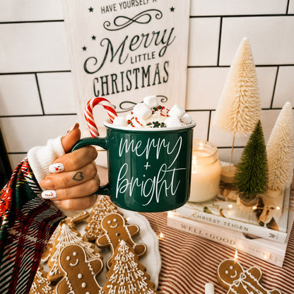 Merry & Bright coffee mug by Gia Roma in dark green with white script and marshmallow topping on Tampa Home & Garden Store