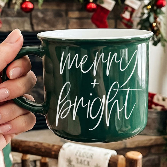 Merry & Bright Gia Roma coffee mug, green ceramic with white script on Tampa Home & Garden Store