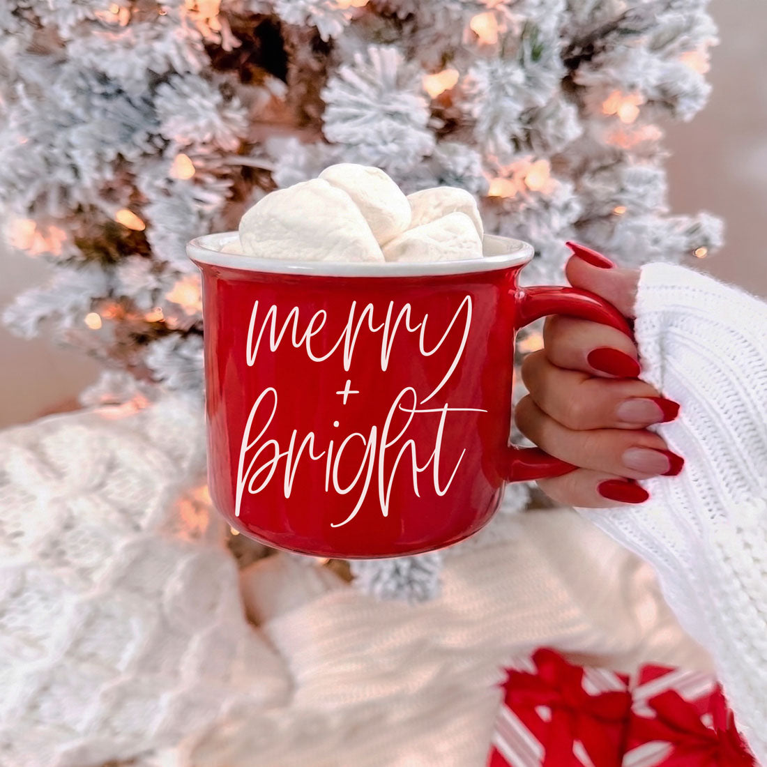 Merry & Bright Gia Roma red ceramic coffee mug with white cursive text and three marshmallows on Tampa Home & Garden Store