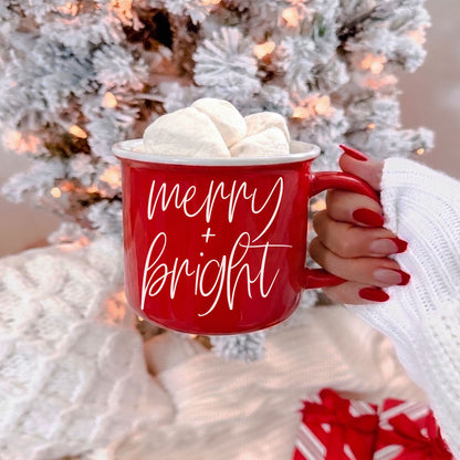 Merry & Bright Gia Roma red ceramic coffee mug with white cursive text and three marshmallows on Tampa Home & Garden Store