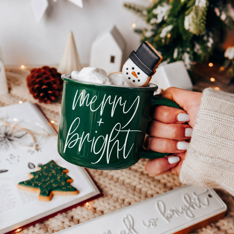 Merry & Bright green ceramic coffee mug with snowman topper and marshmallows on Tampa Home & Garden Store