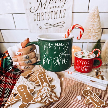 Merry & Bright coffee mug by Gia Roma, green ceramic; red mug visible (2 mugs) on Tampa Home & Garden Store