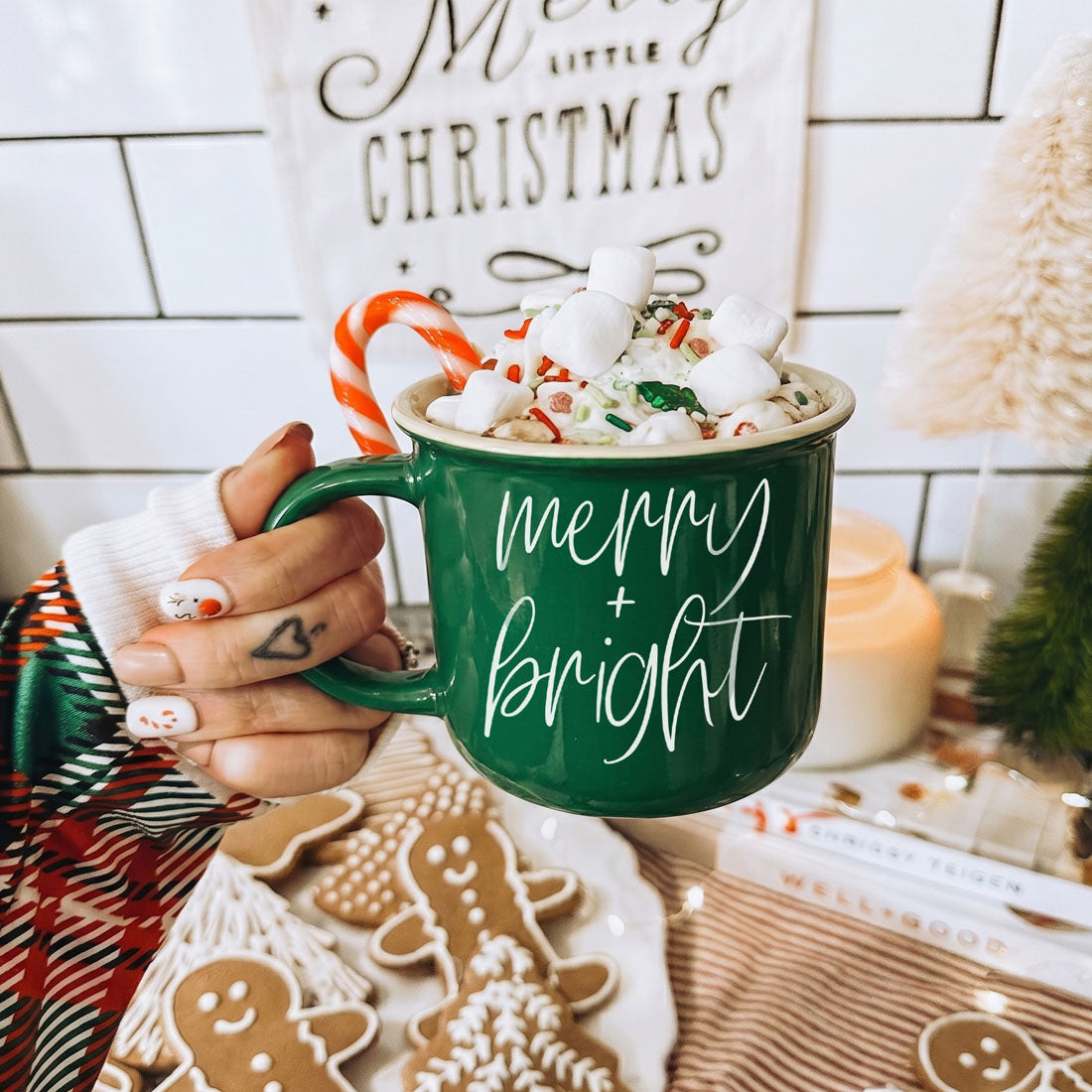 Merry & Bright green ceramic coffee mug by Gia Roma topped with marshmallows, sprinkles and a candy cane on Tampa Home & Garden Store