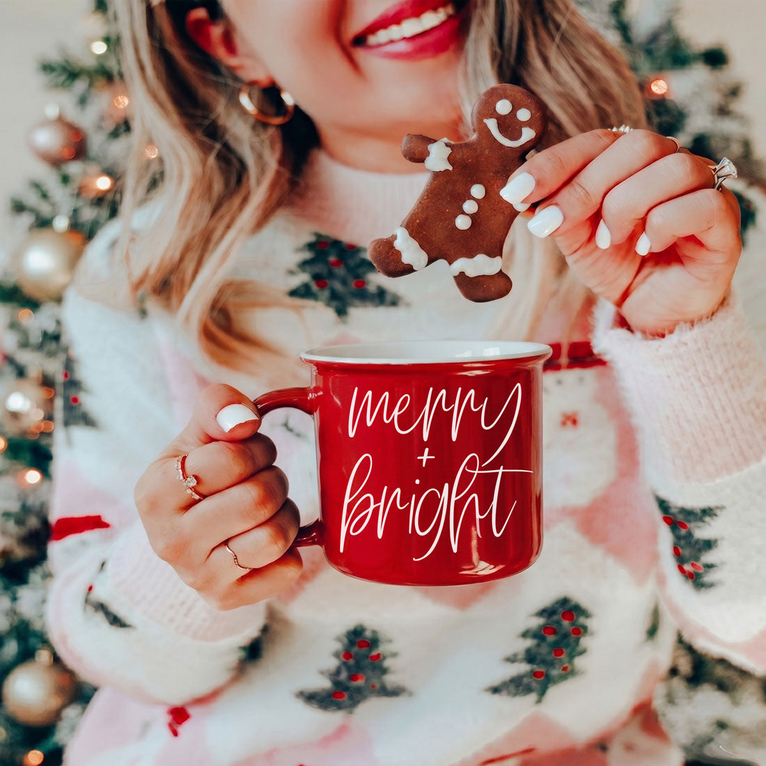 Merry & Bright coffee mug in red with white script beside a gingerbread cookie on Tampa Home & Garden Store