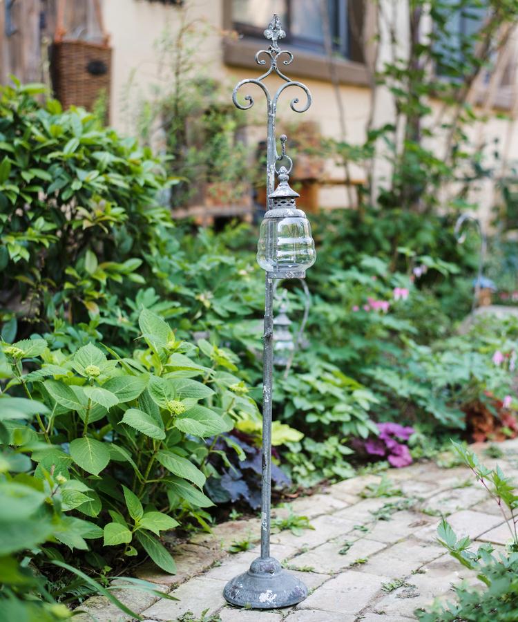 Metal hanging plant stand with lantern hook, ornate scrollwork, adjustable height garden stake on Tampa Home & Garden Store