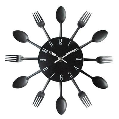Stevvex metal kitchen wall clock with forks and spoons around a black dial on Tampa Home & Garden Store