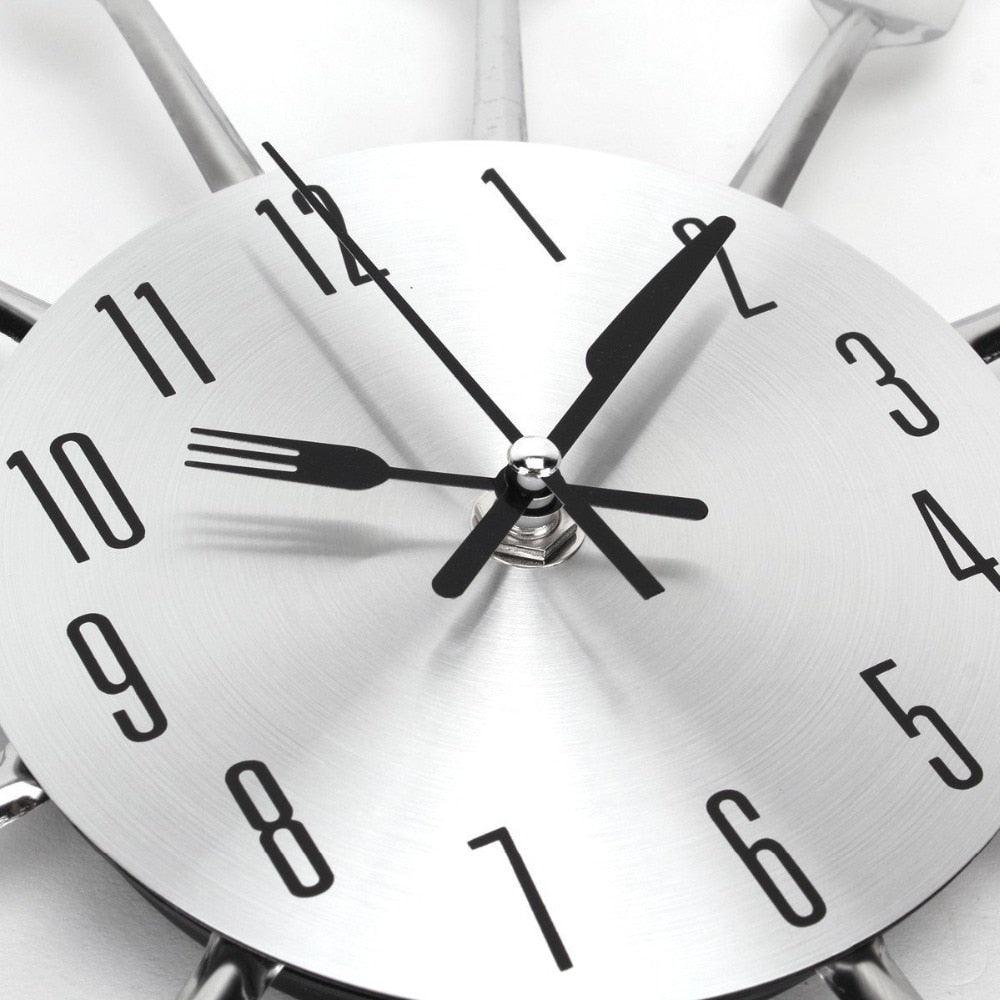 Metal kitchen wall clock by Stevvex with 3D cutlery design and stainless steel face on Tampa Home & Garden Store