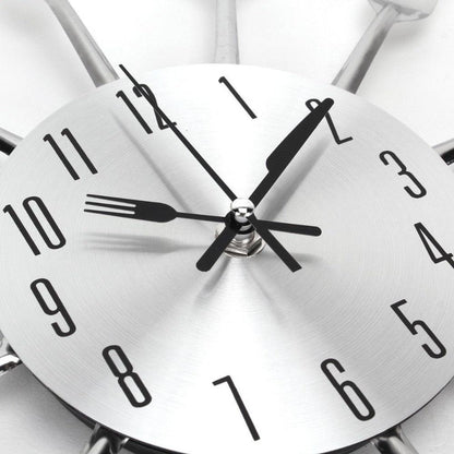 Metal kitchen wall clock by Stevvex with 3D cutlery design and stainless steel face on Tampa Home & Garden Store