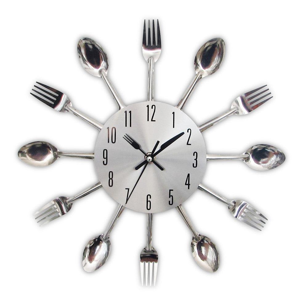 Stevvex metal kitchen wall clock with a silver sunburst design made from forks and spoons on Tampa Home & Garden Store