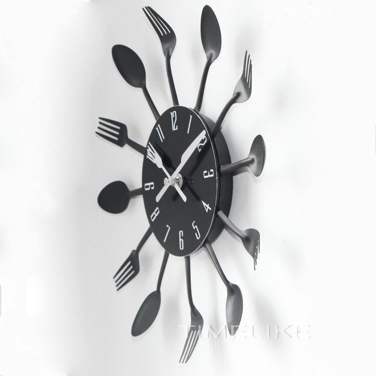 Metal kitchen wall clock with black round dial and 12 silver cutlery spokes (spoons and forks) on Tampa Home & Garden Store