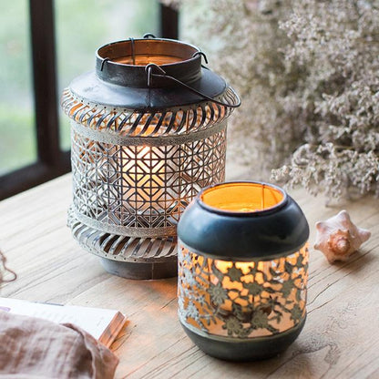 Metal lantern candle holder RusticReach, two gray lattice lanterns with warm glow on Tampa Home & Garden Store