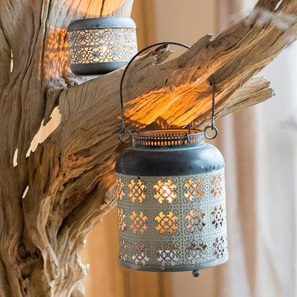 Metal lantern candle holder, gray finish with floral cutouts, 2 hanging lanterns on driftwood on Tampa Home & Garden Store