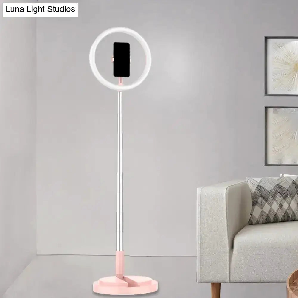 Metallic silver LED makeup lamp with phone holder, ring light around phone on pink base on Tampa Home & Garden Store