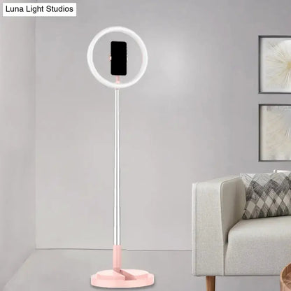 Metallic silver LED makeup lamp with phone holder, ring light around phone on pink base on Tampa Home & Garden Store